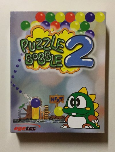 Boîte de la version PC (Windows) de Puzzle Bobble 2, éditée par Agetec, avec Bub le dinosaure vert