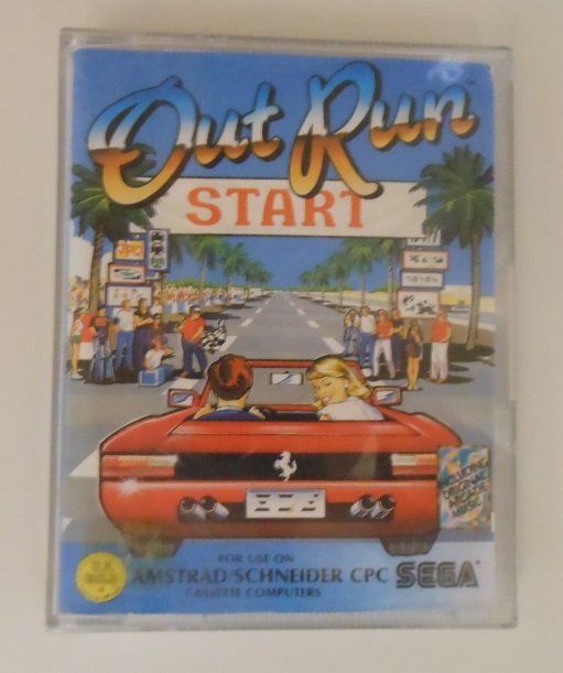 Boîtier cassette d'OutRun pour Amstrad CPC/Schneider, édition Sega avec illustration de la Ferrari Testarossa
