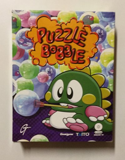 Boîte de la version PC CD-ROM de Puzzle Bobble, édition GameBank/Taito avec illustration de Bub le dinosaure